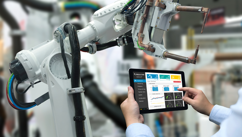 Worker controlling robotic arm with tablet