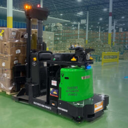 Warehouse automation robots in industrial setting